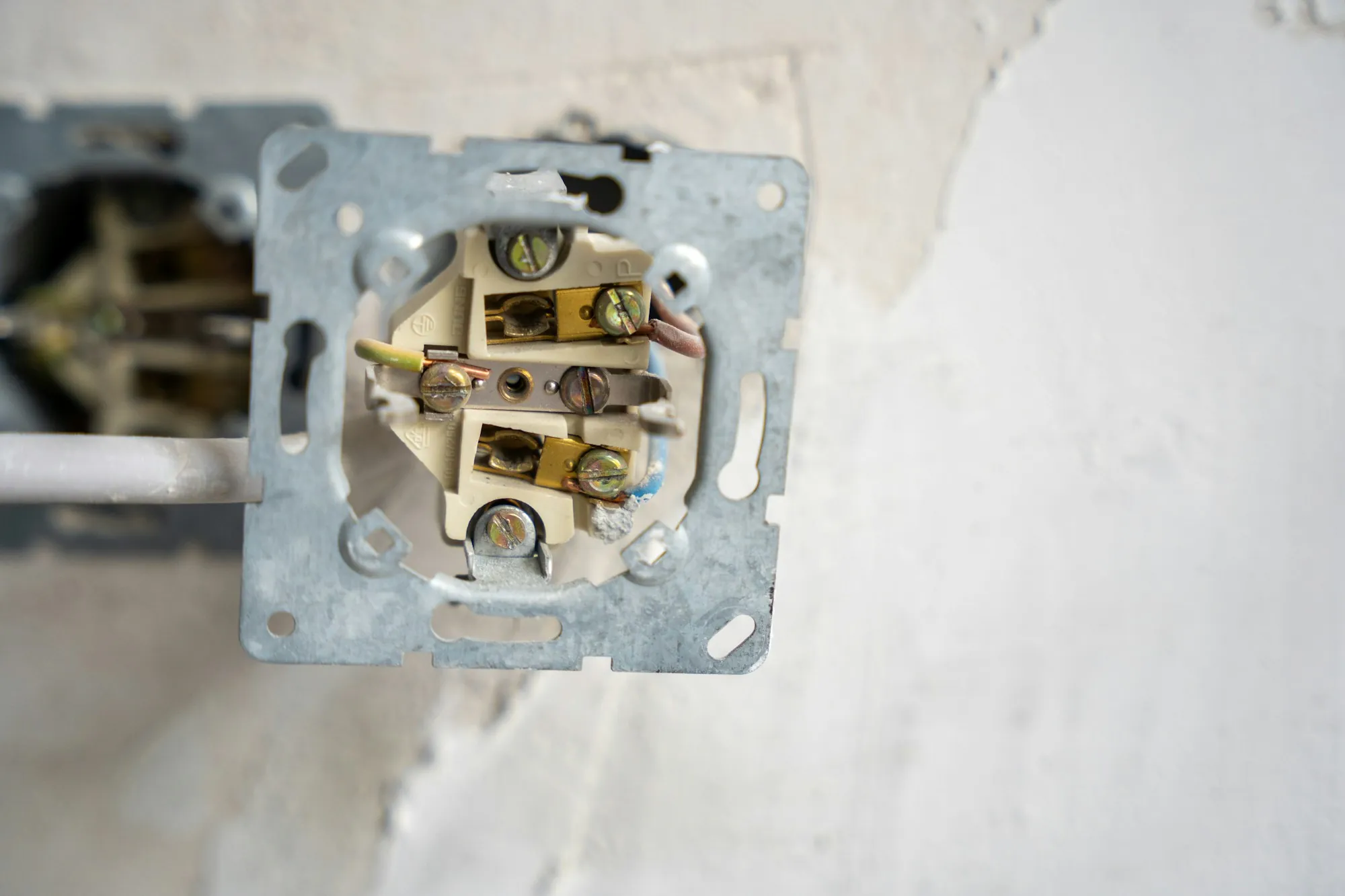 Open electrical box in a wall ready for a new receptacle