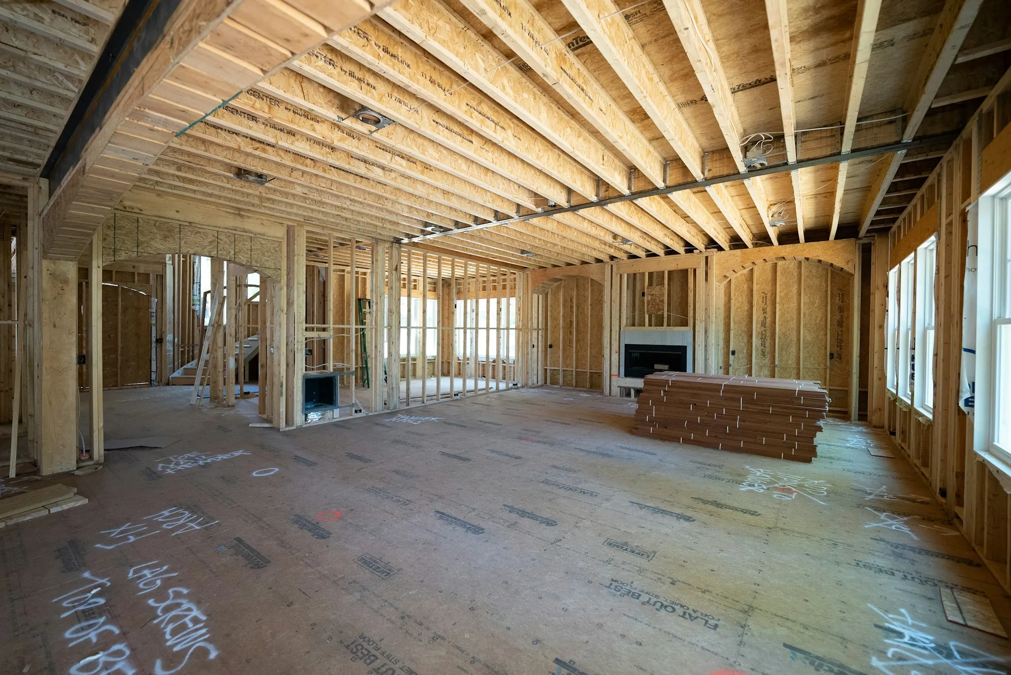 Wood-framed interior of a new house before drywall